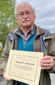 George Utermohle holding his Great Egret Award