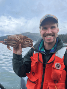 Picture of a man holding a dungeness crab